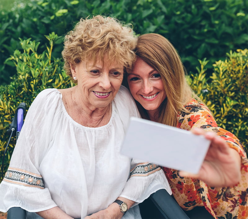 Woman with MS being helped by a loved one.